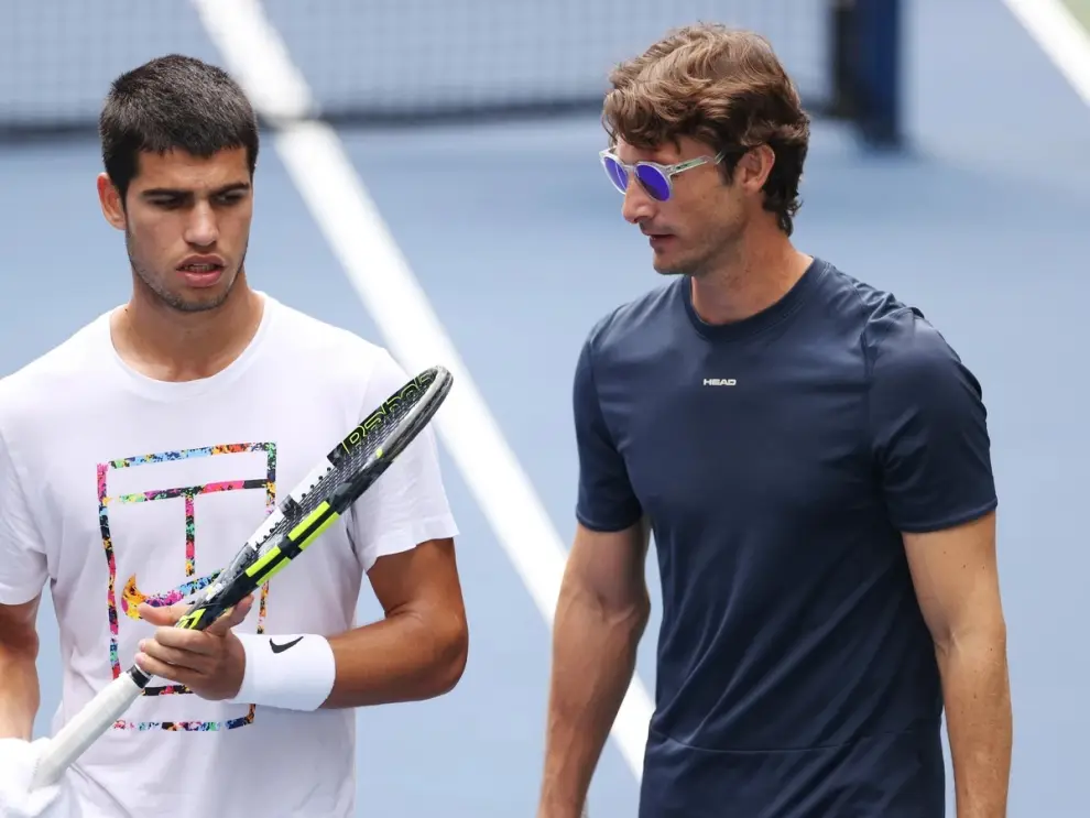 Alcaraz y su exentrenador Ferrer.